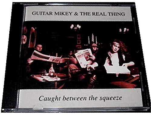 GUITAR MIKEY & THE REAL THING - CAUGHT BETWEEN THE SQUEEZE